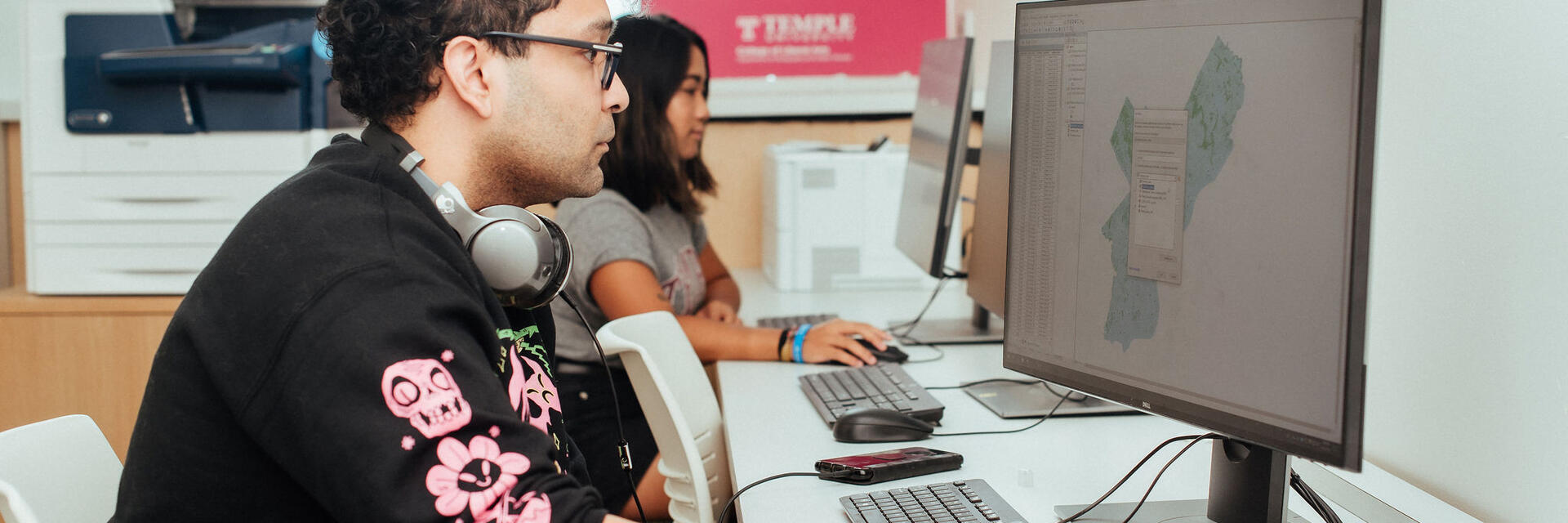 image of GUS students working on mapping software on their computers
