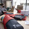 image of students packing bags for a community event