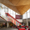 image of Mazur Hall entrance with students walking around and sitting