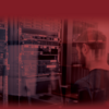 image of a man standing at a set of computer servers