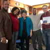 image of Lori, David, John and two other Inside-Out members standing for a group photo in their office