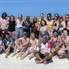 image of Monserrat and group of students on a beach