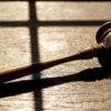 image of a gavel lying in a table