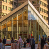 image of mazur terrace in the evenig with people socializing at an event