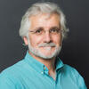 Gerardo Augusto Lorenzino in a blue shirt staring into the camera