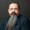 José Manuel Pereiro-Otero in a black shirt staring into the camera
