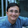 Peter Sicher in a blue shirt smiling into the camera