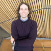 Arthur Krieger in purple sweater with his arms crossed smiling into the camera