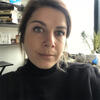 Lauren Olsen wearing a black shirt in an office staring into the camera