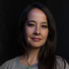 image of Michelle wearing a grey top and looking at the camera