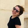 image of Lauren wearing sunglasses and smiling at the camera