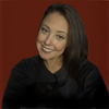 Elizabeth Adams in a black shirt smiling into the camera