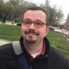 Sean D. Harris in a black shirt outside smiling into the camera